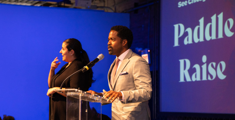 Roderick Hawkins emcees SCD's first-ever paddle raise at the  See Chicago Dance 2024 Gala Community Celebration & Awards Presentation