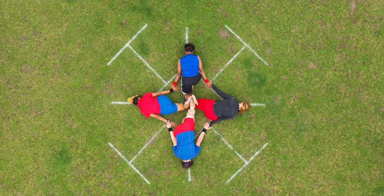 four symmetrical, interconnected bodies, seen by an overhead drone