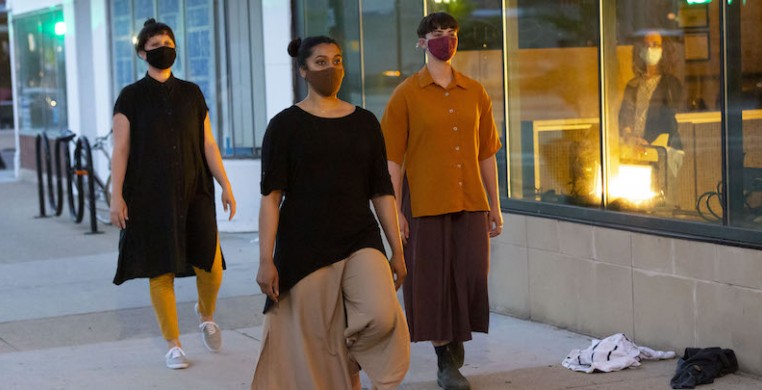 Danielle Ross (left) performs "Granular Peripheries" with Tuli Bera (center) and Ali Lorenz outside The Edge Theater as part of the Pivot Arts Festival. Photo by William Frederking.