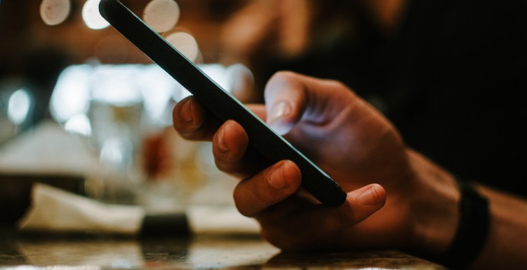 Modern technology makes it possible to stay in touch easily during stay-at-home orders. But you might also be feeling a bit of digital overload—how can you stay connected to others without reaching for your phone? (photo: Unsplash/Alex Ware)