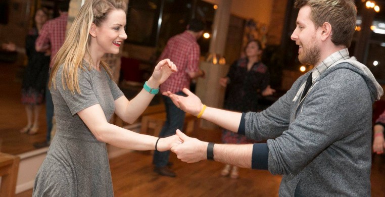 A couple swing dancing at Ballroom Dance Chicago