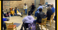 Photo of LabE participants sitting in a circle
